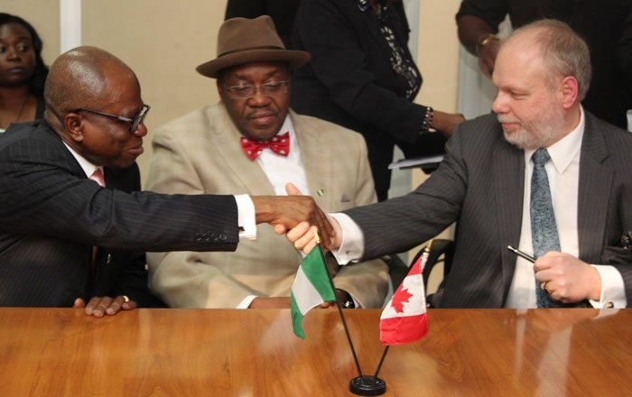 Nigeria High Commissioner, Chief Ojo Uma Maduekwe Permanent Secretary, Federal Ministry of Power, Amb. Godknows Boladei Igali and SkyPower Global's Vice President of Development for Africa, Benoit Fortin during the signing of the agreements in Abuja, Nigeria