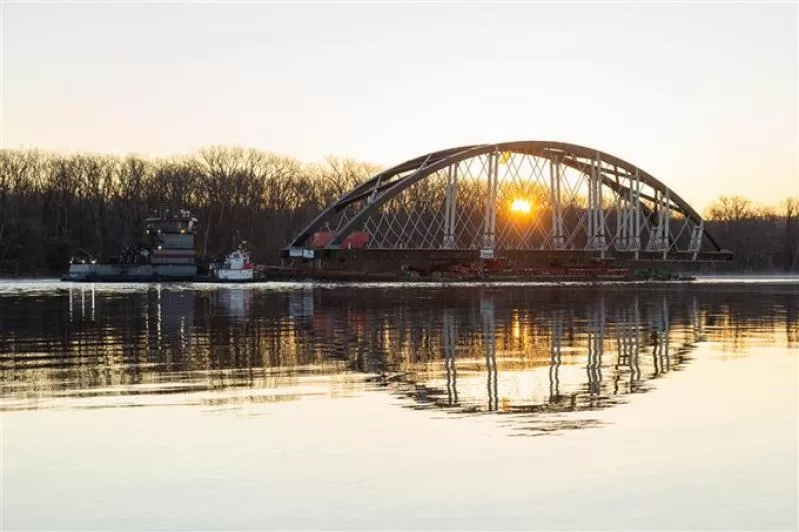 The first arch of the new Portal North Bridge in transit over the Hudson River