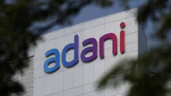 Adani Group logo seen atop company building.